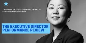 Black and white image of a woman in suit jacket with The Executive Director Performance Review in blue text